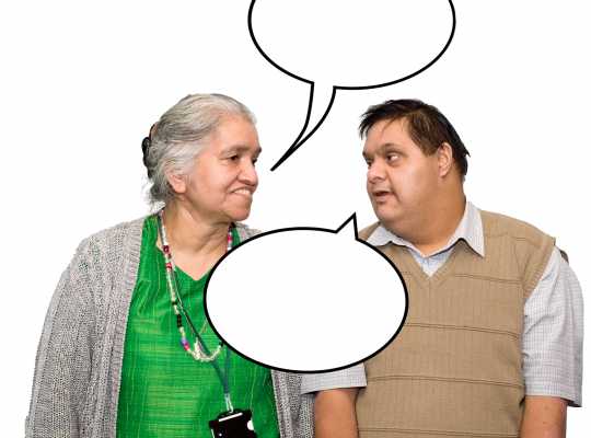 Elderly woman and man with Down syndrome talking with speech bubbles above their heads.