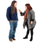 Two individuals having a friendly conversation, one with long dreadlocks and the other with short red hair, set against a white background.