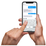 Hands holding a smartphone with a text message conversation on the screen.